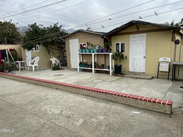 rear view of house with a patio