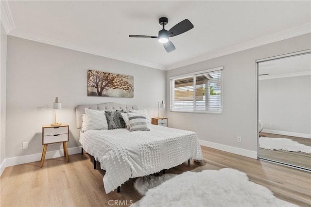 bedroom featuring ornamental molding and light hardwood / wood-style floors