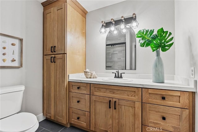 bathroom with vanity, tile patterned floors, and toilet