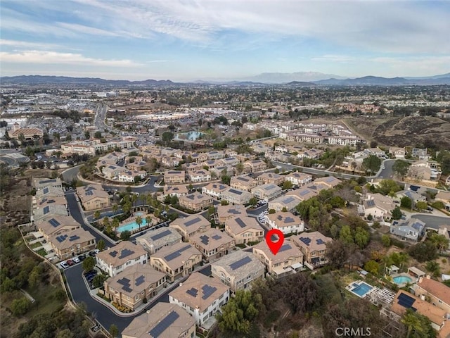 birds eye view of property with a mountain view