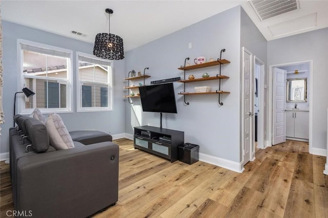 living room with light hardwood / wood-style floors