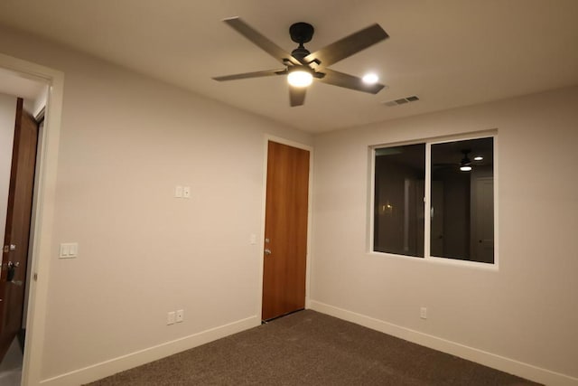 carpeted empty room featuring ceiling fan