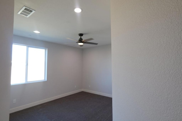 carpeted empty room with ceiling fan