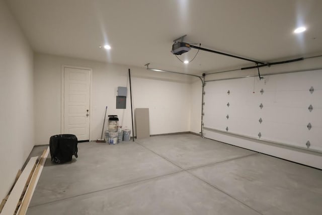 garage featuring a garage door opener and electric panel