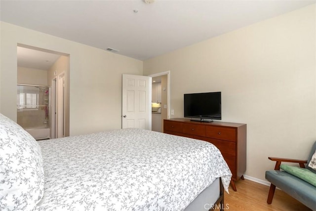 bedroom with light hardwood / wood-style floors