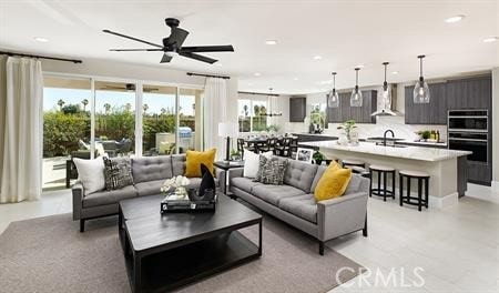 living room with sink and ceiling fan