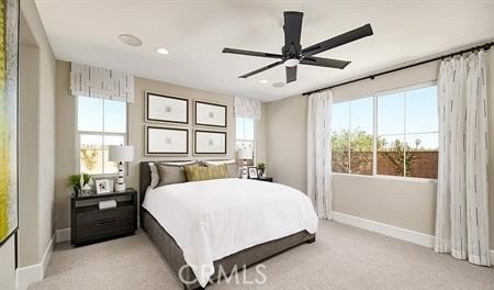 bedroom with light carpet and ceiling fan