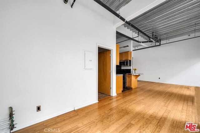 unfurnished living room featuring light hardwood / wood-style flooring