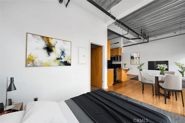 bedroom with wood finished floors