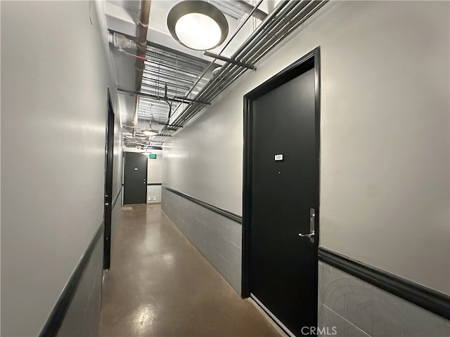 corridor with finished concrete flooring