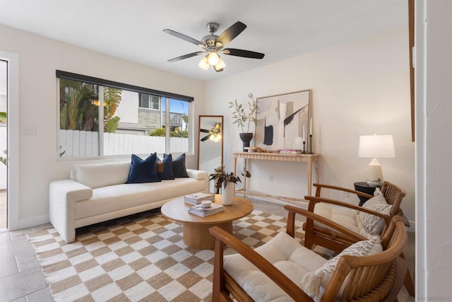 sitting room featuring ceiling fan