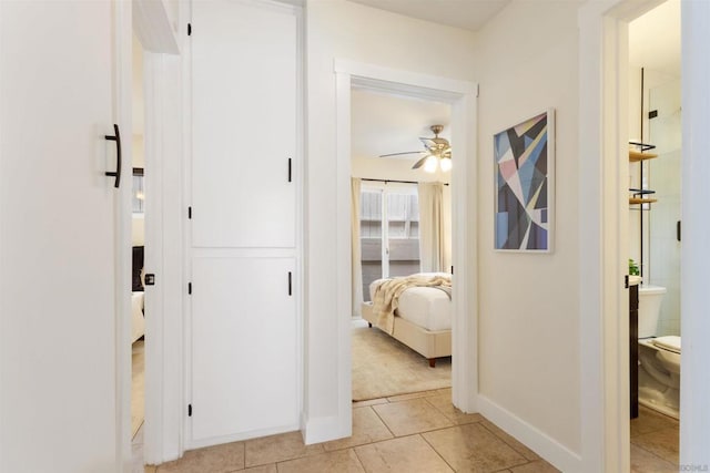 hallway with light tile patterned floors