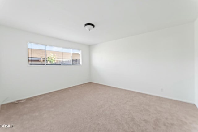 empty room featuring carpet flooring