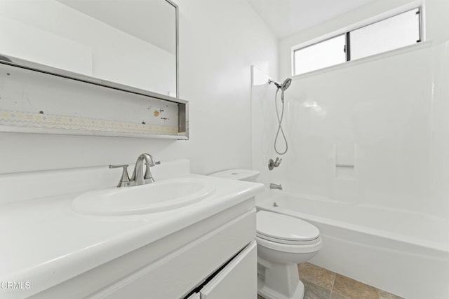 bathroom featuring bathing tub / shower combination, vanity, and toilet