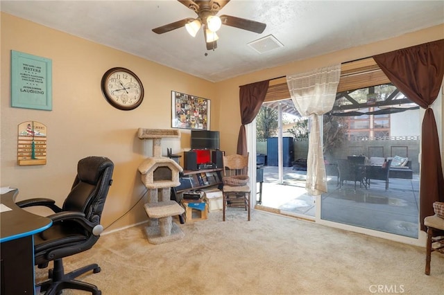 home office featuring carpet floors and ceiling fan