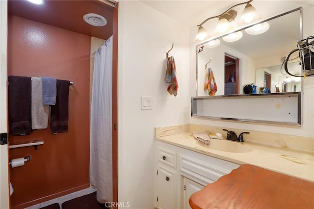 bathroom with vanity and walk in shower