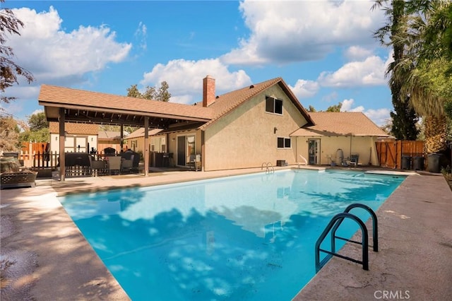 view of swimming pool featuring a patio