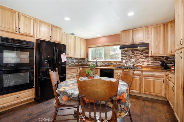 kitchen featuring backsplash, dark wood-type flooring, black appliances, and light brown cabinets