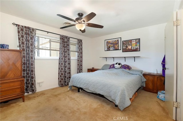 bedroom with light colored carpet and ceiling fan