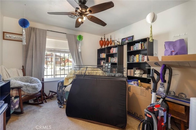 interior space with light colored carpet and ceiling fan