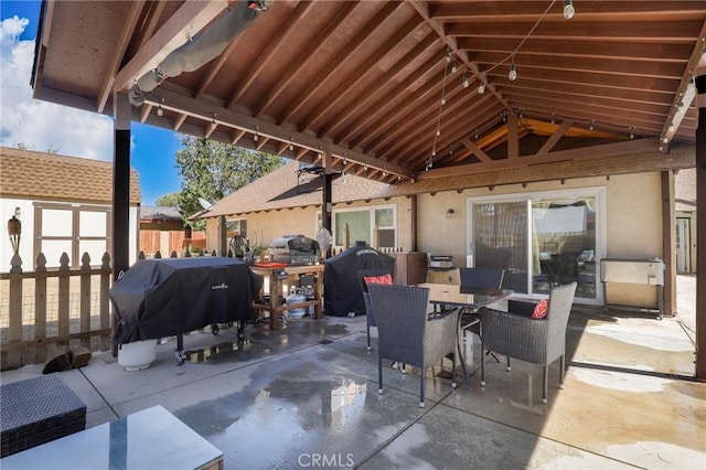 view of patio featuring grilling area and a storage shed