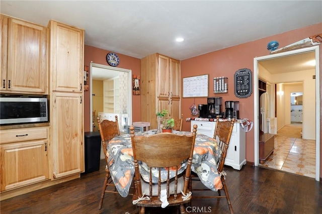 dining room with dark hardwood / wood-style floors