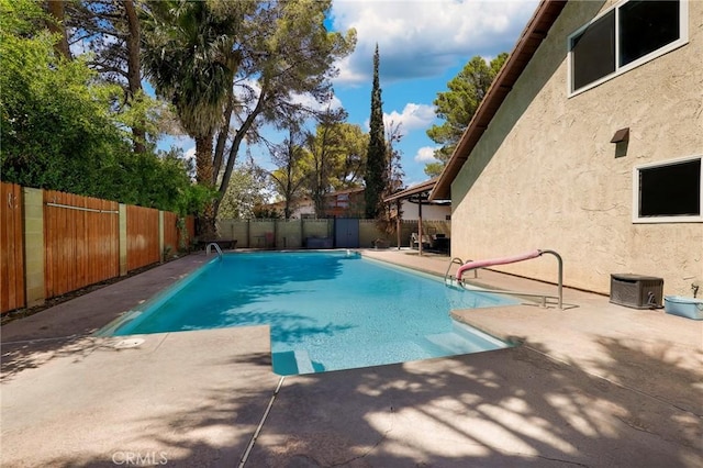 view of swimming pool featuring a patio