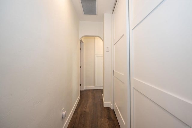 corridor with dark hardwood / wood-style floors