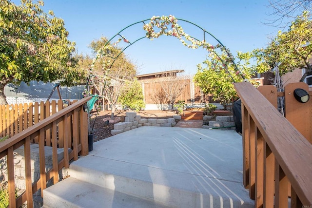 wooden deck with a patio