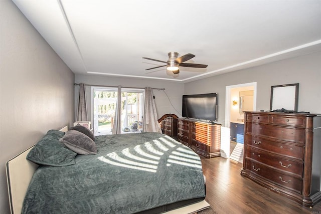 bedroom featuring dark hardwood / wood-style floors, access to outside, and ceiling fan