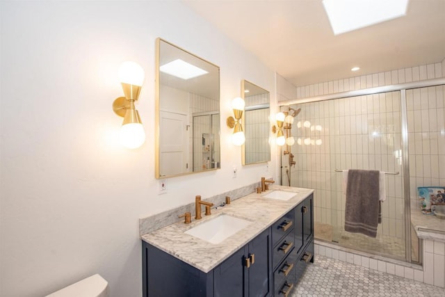 bathroom featuring vanity, tile patterned flooring, and walk in shower