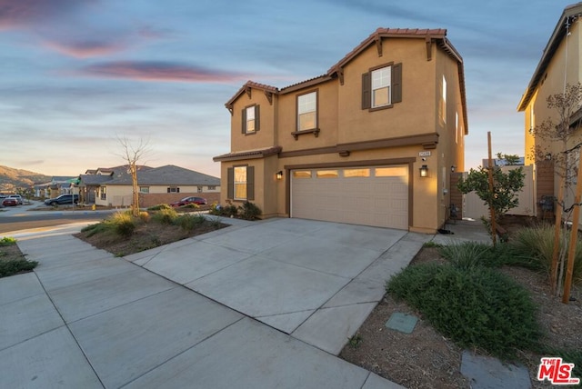 view of front of property with a garage