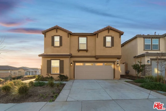 view of front of property with a garage