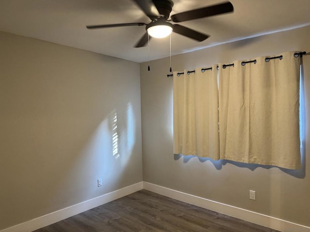 unfurnished room with dark hardwood / wood-style floors and ceiling fan