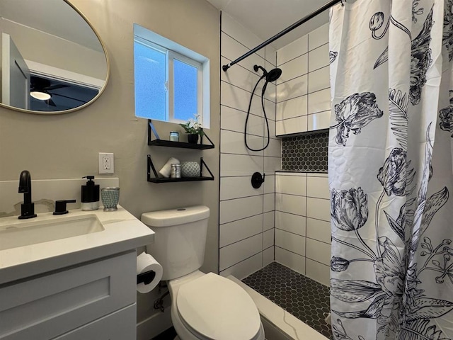 bathroom featuring walk in shower, vanity, and toilet