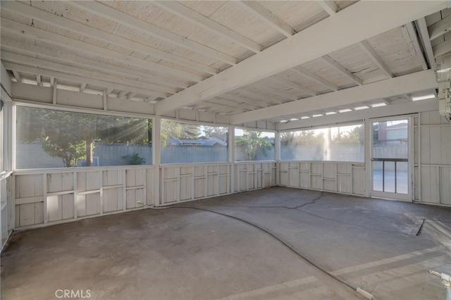 unfurnished sunroom with a water view and plenty of natural light