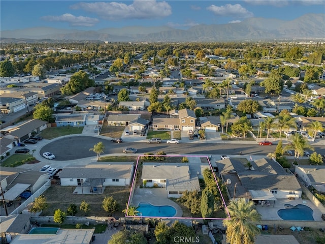 drone / aerial view with a residential view and a mountain view