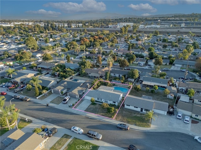 birds eye view of property with a residential view