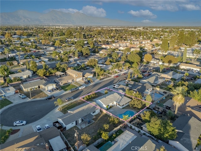 birds eye view of property with a residential view and a mountain view