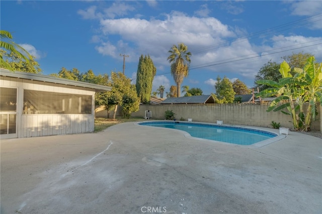 view of swimming pool with a fenced in pool, a patio area, and a fenced backyard