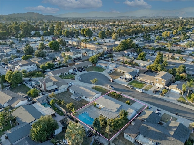 birds eye view of property featuring a mountain view and a residential view