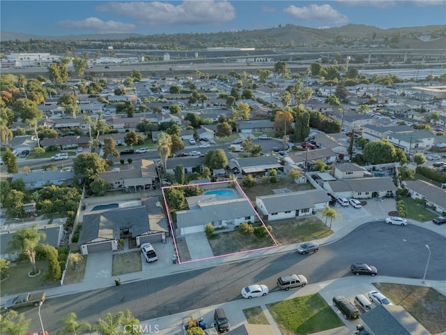 aerial view featuring a mountain view and a residential view