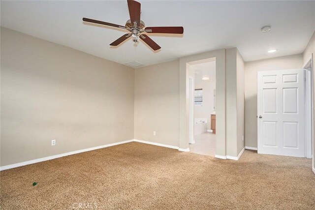 carpeted empty room with ceiling fan