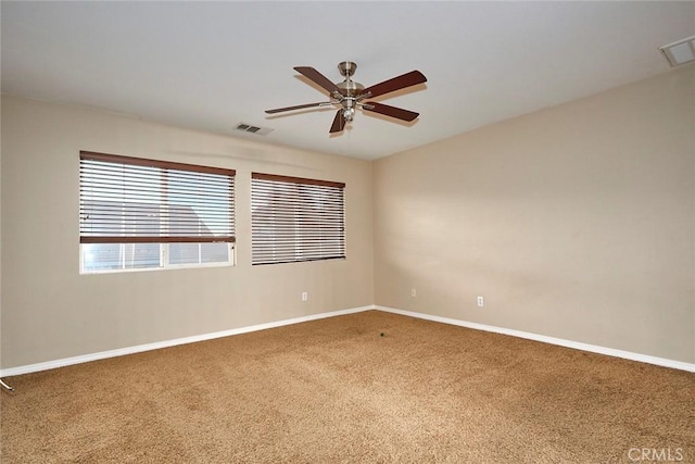 unfurnished room featuring carpet and ceiling fan