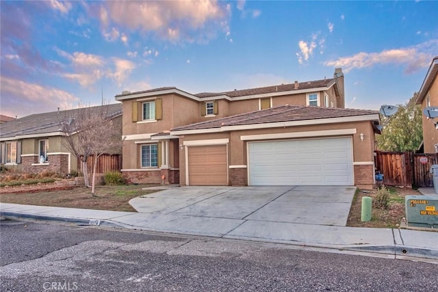 front of property with a garage