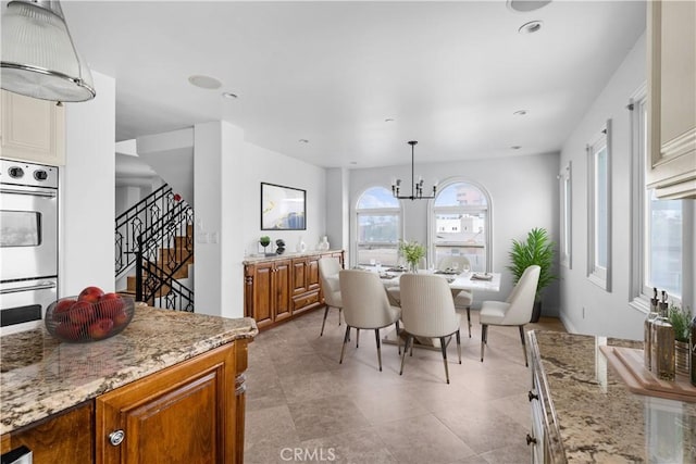 dining room featuring a notable chandelier