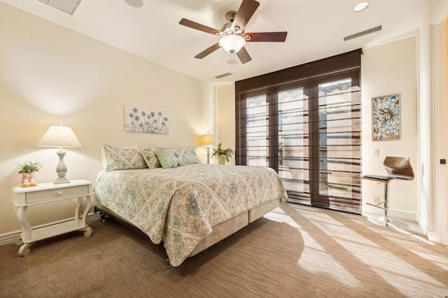 bedroom featuring light carpet and ceiling fan