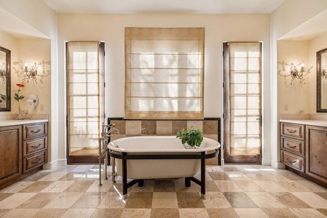 bathroom featuring vanity and a bath