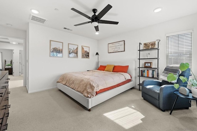 bedroom featuring ceiling fan and light carpet