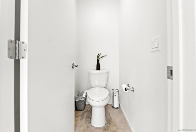 bathroom with tile patterned floors and toilet